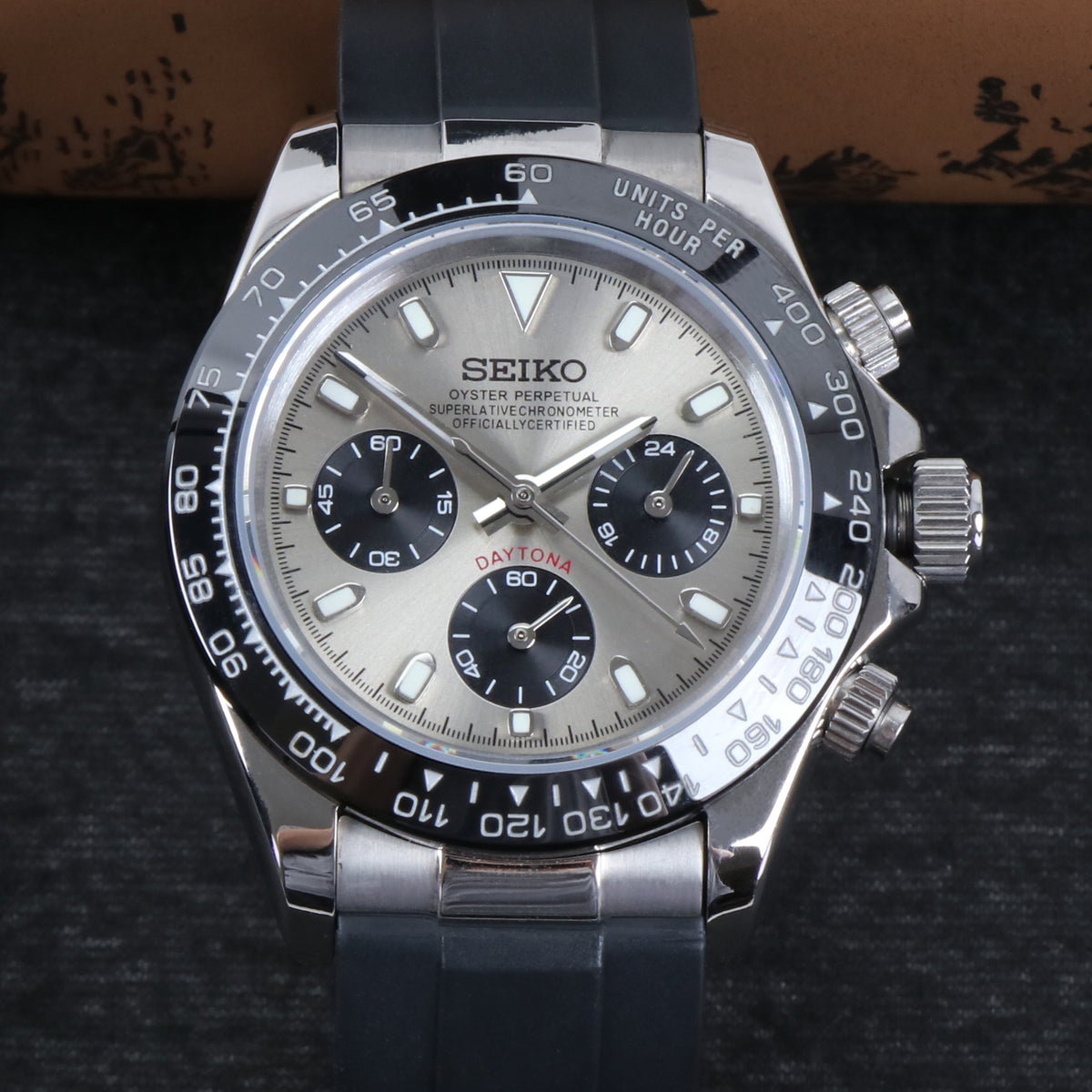 Seiko watch with black and silver design on a dark background