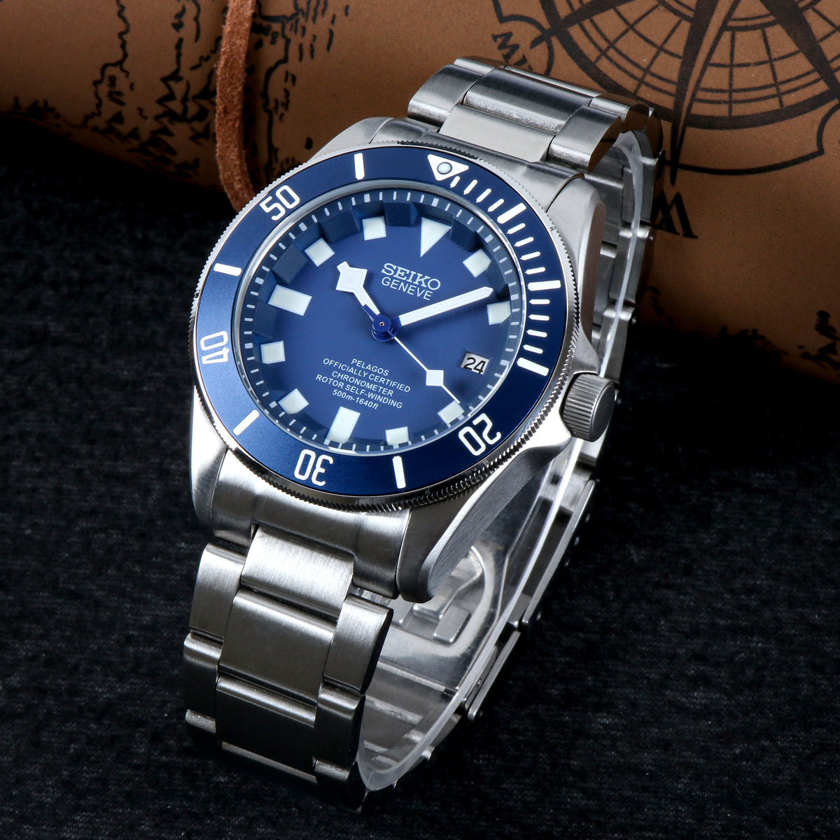 Silver Seiko watch with blue dial on a textured surface